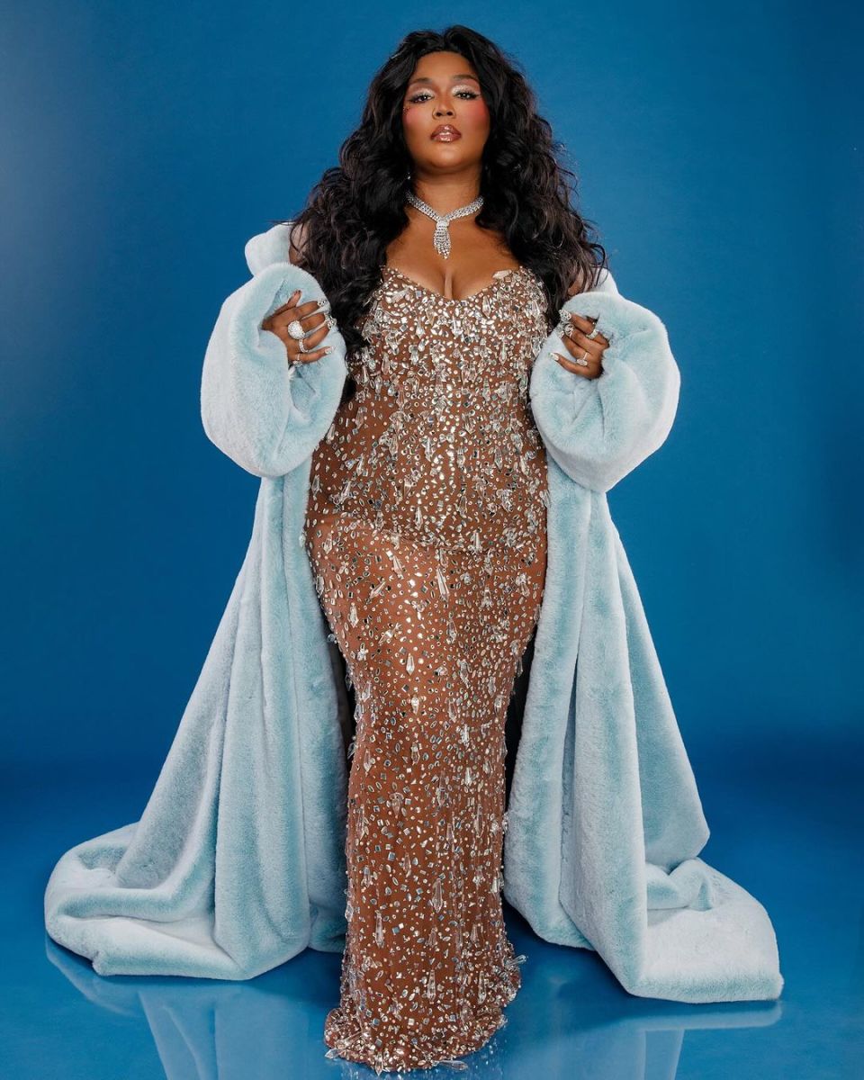 Lizzo posing for the camera in an ornate outfit, Photo Credit: lizzobeeating/Instagram