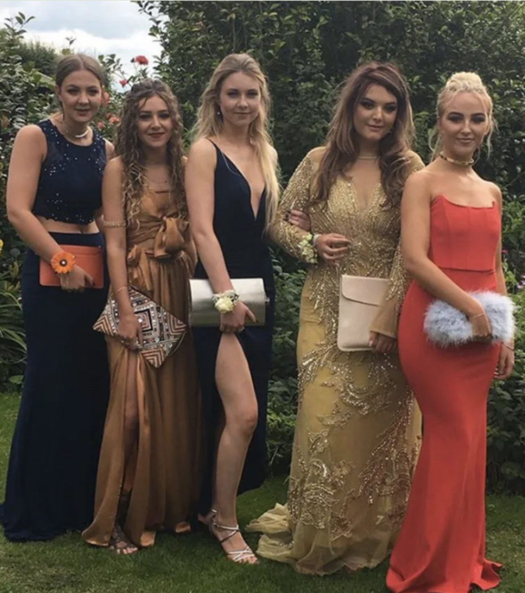 Eleanor Clarke with friends posing for pre-prom photo discreetly carrying a flask instead of a handbag, Photo Credit: Yahoo